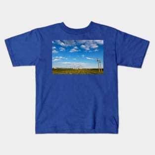 Blue cloudy sky over factory, industrial zone, Romania Kids T-Shirt